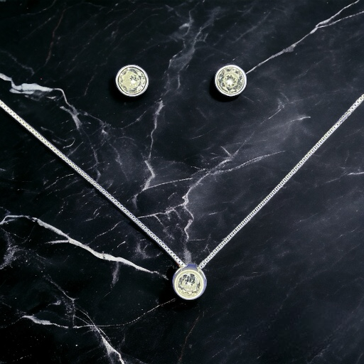 CONJUNTO DE PLATA FINA PUNTO DE LUZ CIRCÓN SIN VALIER