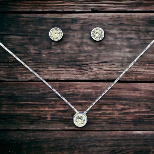 CONJUNTO DE PLATA FINA PUNTO DE LUZ CIRCÓN SIN VALIER