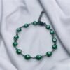 PULSERA EN ACERO QUIRURGICO OJOS VERDES