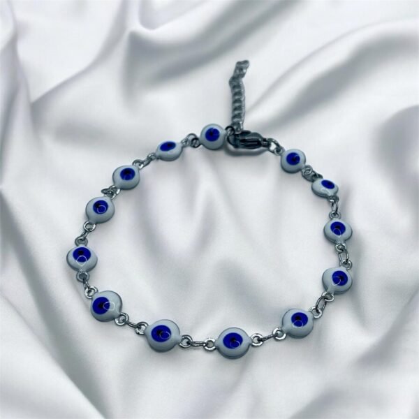 PULSERA EN ACERO QUIRURGICO OJOS BLANCOS