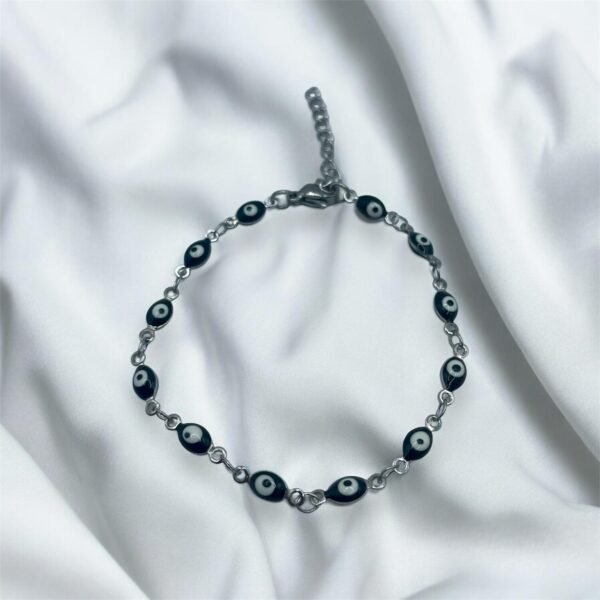 PULSERA EN ACERO QUIRURGICO OJOS NEGROS