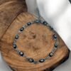 PULSERA EN ACERO QUIRURGICO OJOS NEGROS
