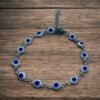 PULSERA EN ACERO QUIRURGICO OJOS BLANCOS