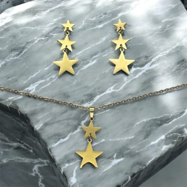 CONJUNTO EN ACERO QUIRURGICO ESTRELLAS DEGRADÉ DORADO